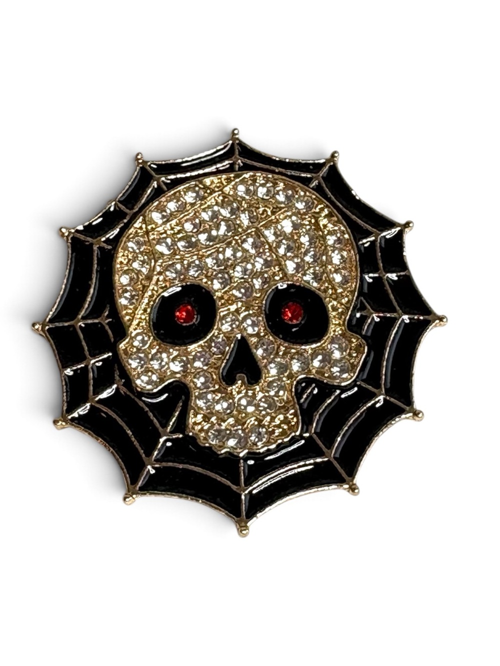 Skull on a web rhinestone embellished brooch